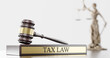Tax Law: Judge's Gavel as a symbol of legal system, Themis is the goddess of justice and wooden stand with text word