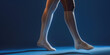Vibrant Comfort: Legs in Compression Stockings on simple flat background with copy space. Female legs clad in medical compression stockings socks.
