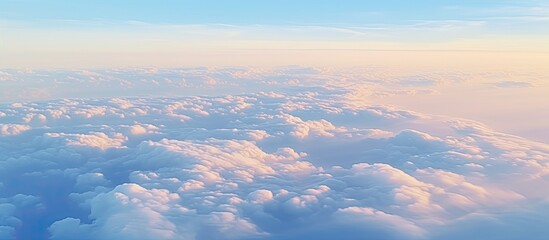Wall Mural - the image shows the aerial perspective from an airplane window, capturing a vast expanse of sky fill