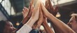 © Zaleman - Multiethnic team gives high five at meeting, diverse group of colleagues join hands together in celebration of corporate growth, successful teamwork, and unity help to support business concept
