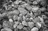 Fototapeta Nowy Jork - Black and white close up photo of pumice stones, nature background, Galapagos Islands, Ecuador.