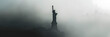 Statue of Liberty silhouette in mist, iconic landmark. 