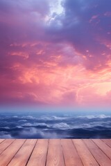 Wall Mural - Wooden floor with a beautiful sunset sky and clouds in the background