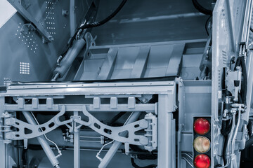 Poster - A modern machine for transporting waste waste with a press and automatic loading and unloading, rear view of the mechanization and trash can
