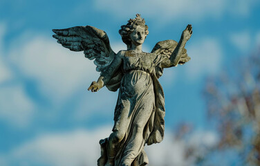 Poster - Angel statue on top of a building, suitable for architectural projects