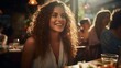 © Adobe Contributor - Portrait of a young woman smiling in a restaurant with friends in the background
