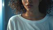 Close-up image of a woman with curly hair, suitable for beauty and fashion concepts