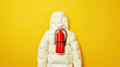 A white puffer jacket shaped like a fire extinguisher, in the style of product photography, on a yellow background, at high resolution