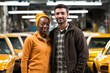 © Adobe Contributor - Portrait of two smiling multiethnic workers in a factory