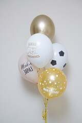 Wall Mural - a set of beige and gold balloons on a white background, the inscription on the balloon: “Live now”, “Let your dreams come true”