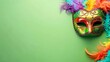 Multicolored carnival mask banner with space for text on green background
