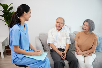 Wall Mural - nurse or caregiver meeting and talking with about health with senior couple