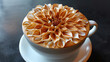 Intricate Coffee Blossom. A close-up view of a coffee cup adorned with an exquisitely crafted foam art resembling a blooming flower. The intricate design showcases exceptional barista skills.