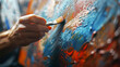 artist at work in workshop, close up of a young artist is painting with brush in his studio, painting scene on the canvas