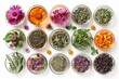 Assorted herbal tea ingredients in glass bowls