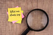 What our clients say word on sticky note and magnifying glass