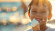 © Paula - Joyful boy eating a soft-serve ice cream cone at the beach