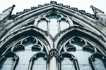 Wall Mural - A close-up of an old Gothic window, its intricate tracery and pointed arches standing out starkly against a pure white background