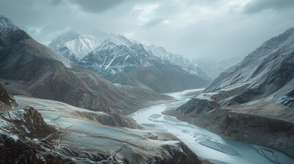 Canvas Print - Scenic view of a mountain range with a river flowing through it. Suitable for travel and nature concepts