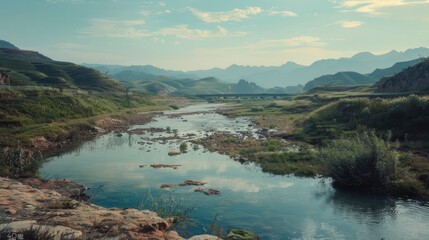 Poster - Serene river flowing through a vibrant green valley, ideal for nature and landscape themes