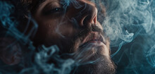 A Man Exhaling Smoke From A Cigarette. Ideal For Illustrating Addiction Or Relaxation