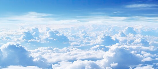 Wall Mural - The sky is filled with numerous clouds floating above the earth's surface