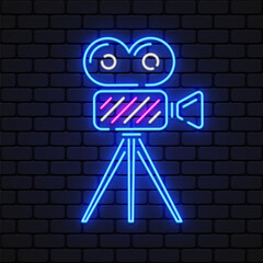 Wall Mural - Video camera neon sign. Luminous signboard with retro film production equipment. Vector illustration