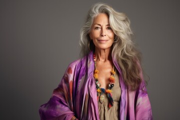 Wall Mural - Portrait of a beautiful senior woman with long gray hair. Studio shot.