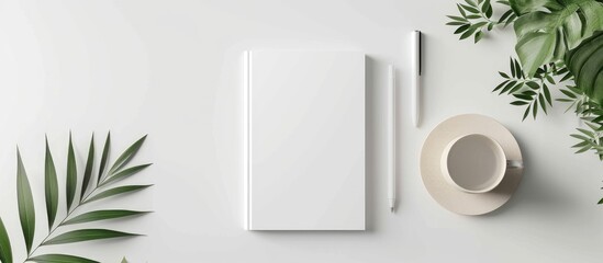 Wall Mural - Blank notepad cover displayed on a white table for mock-up purposes.