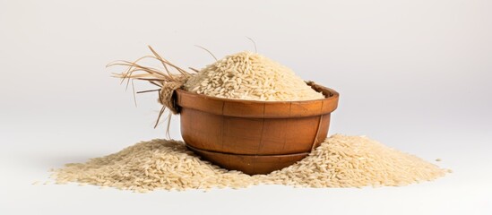 Sticker - A wooden bowl filled with rice serves as the focal point on top of a mound of rice, creating a beautiful still life photography showcasing this staple food ingredient