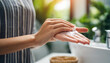 woman's hand applying lotion, symbolizing self-care, hydration, skincare routine