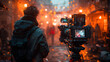 Behind-the-scenes view of a film crew member operating a camera amidst a bustling street with festive lighting and atmospheric smoke