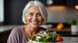 Adult vegetarian woman in casual attire smiling holding a healthy vegetable salad bowl on blurred kitchen background