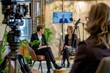 A business talk show segment focused on sustainability and corporate social responsibility, featuring interviews with eco-conscious entrepreneurs and advocates driving positive change, Generative AI