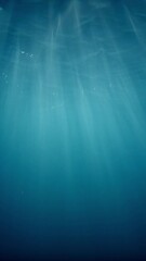 Poster - Sunlight beams filter through the deep, crystal-clear, blue-turquoise water, casting a beautiful curtain of reflections. Air bubbles rise gracefully towards the water's surface, adding to the pictures