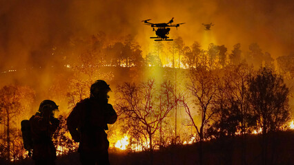 Wall Mural - Firefighting drones spray chemical to help control wildfires.