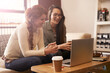 © Bergen/peopleimages.com - Coffee shop, teamwork and business women on laptop for conversation, talking or discussion for remote work. Freelance, happy and people on computer for internet, research and website in restaurant