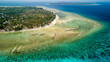 Aerial view of a fringing tropical coral reef around the coastline of a tiny island in Indonesia (Gili Air)
