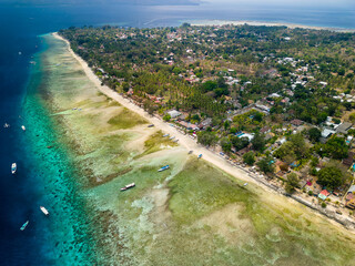 Wall Mural - Aerial view of a fringing tropical coral reef around the coastline of a tiny island in Indonesia (Gili Air)
