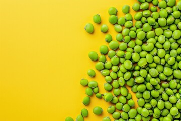 Wall Mural - A Pile of Green Peas on a Yellow Background