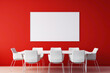 A vibrant red meeting room with a blank white empty frame.
