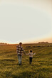 © La Famiglia - Farmer and his little girl enjoying the tranquility of their rural land at dusk