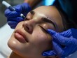 Precision and care in a salon as laser technology erases eyebrow tattoo makeup from a young woman's face, a new start