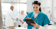 © SneakyPeakPoints/peopleimages.com - Hospital, smile and woman with a tablet, doctor and typing with connection, search internet and employee. Person, nurse and medical professional with technology, clinic and research with website info