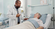 © SneakyPeakPoints/peopleimages.com - Medical stethoscope and doctor with patient in hospital after surgery, treatment or procedure. Discussion, checkup and African male healthcare worker talk to senior man in clinic bed for diagnosis.