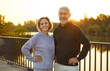 © Studio Romantic - Active senior mature happy smiling couple family standing in city park after workout in nature or jogging exercises. Sport, fitness training in retirement and healthy lifestyle concept.