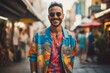 Portrait of a handsome young man with sunglasses and a colorful shirt walking in the city