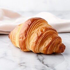 Wall Mural - Buttery croissant isolated on a white countertop