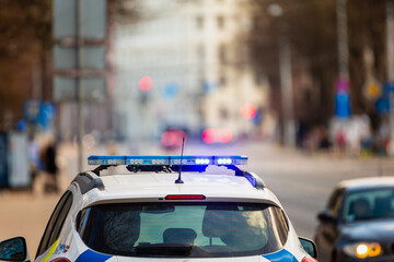 Poster - Police car signal close up in streets for patrolling or doing car stop