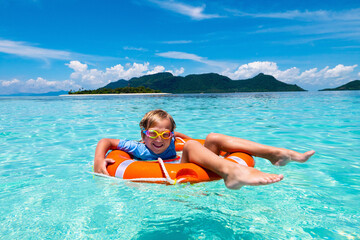 Canvas Print - Child on tropical beach. Sea vacation with kids.